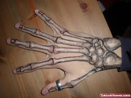 Grey Ink Skeleton Hand Tattoo
