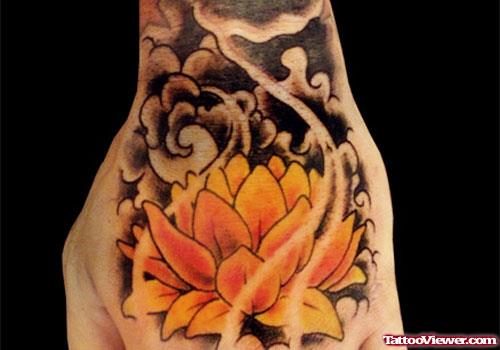 Colored Lotus Flower Tattoo On Left Hand