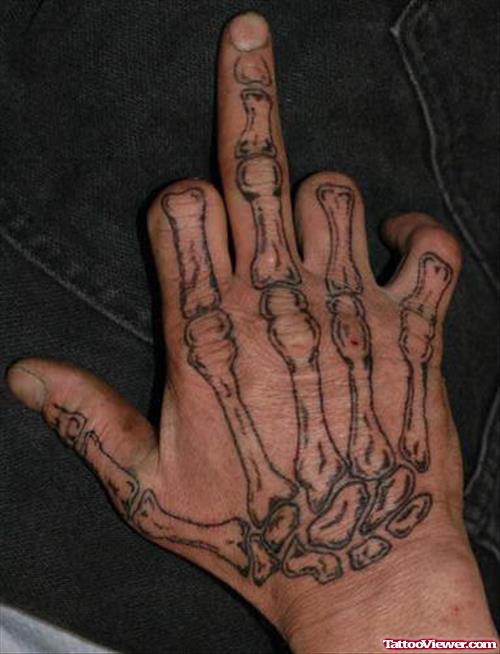Attractive Grey Ink Skeleton Hand Tattoo
