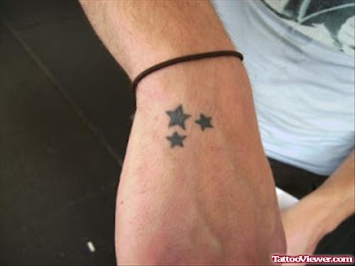 Small Black Stars Hand Tattoo