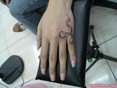 Grey Ink Tribal Tattoo On Girl Left Hand