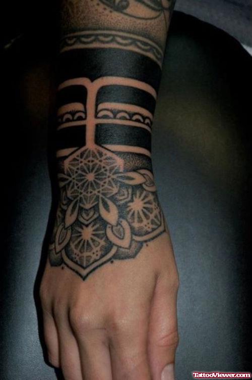 Grey Ink Flower And Tribal Hand Tattoo