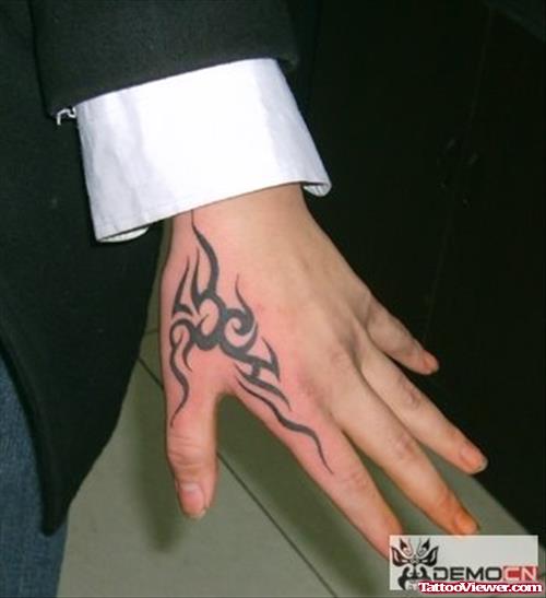 Attractive Black Tribal Hand Tattoo