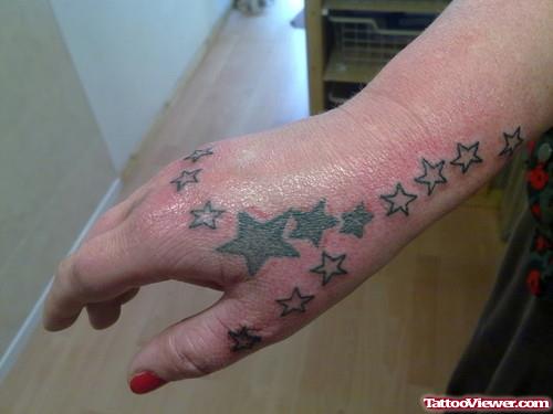 Grey Ink Stars Hand Tattoo