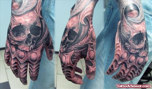 Grey Ink Skull Hand Tattoos