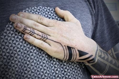 Black Ink Tribal Tattoo On Left Hand And Arm