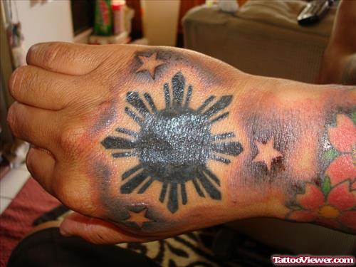 Black Ink Filipino Sun Hand Tattoo