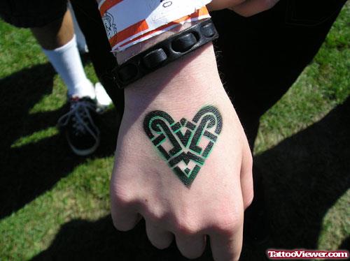 Black Ink Tribal Heart Hand Tattoo