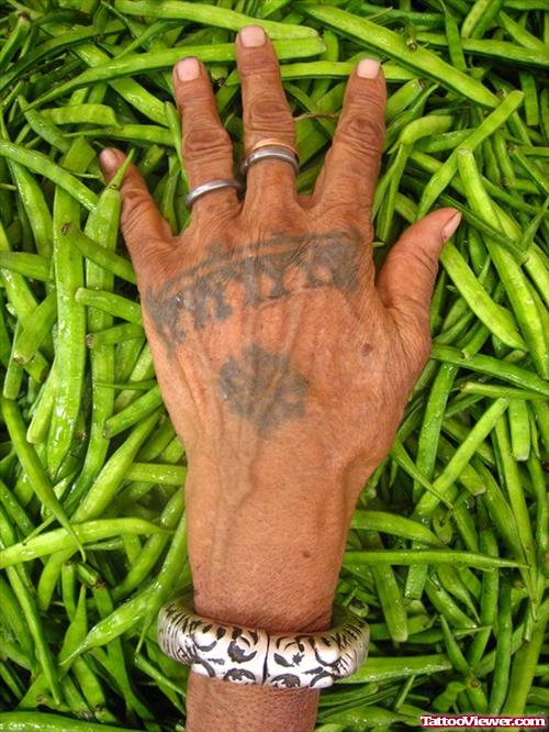 Old Lady Showing Her Hand Tattoo