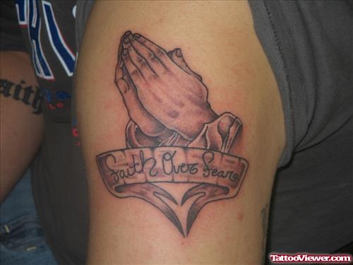 Grey Ink Praying Hands Tattoo On Shoulder
