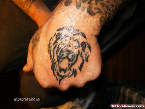 Black Ink Lion Head Tattoo On Left Hand