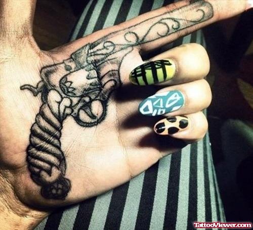 Awesome Grey Ink Gun Tattoo On Left Hand