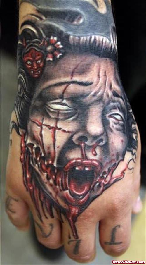 Injured Face Tattoo On Hand