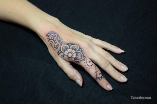 Grey Ink Flower Tattoo On Girl Left Hand