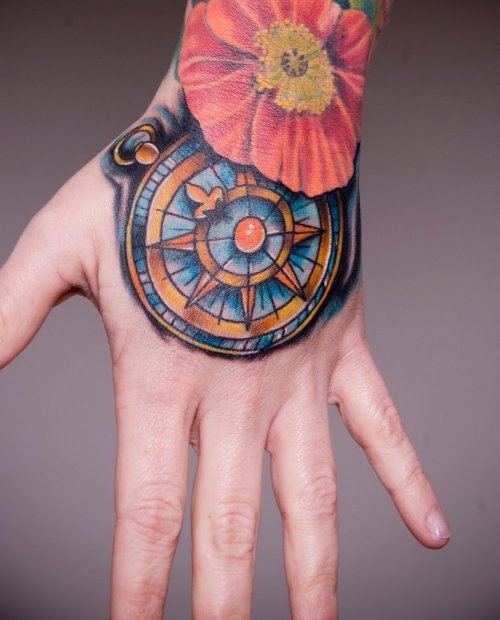 Flower And Compass Hand Tattoo