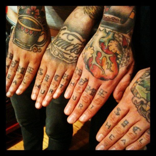 Friends Showing Hand Tattoos