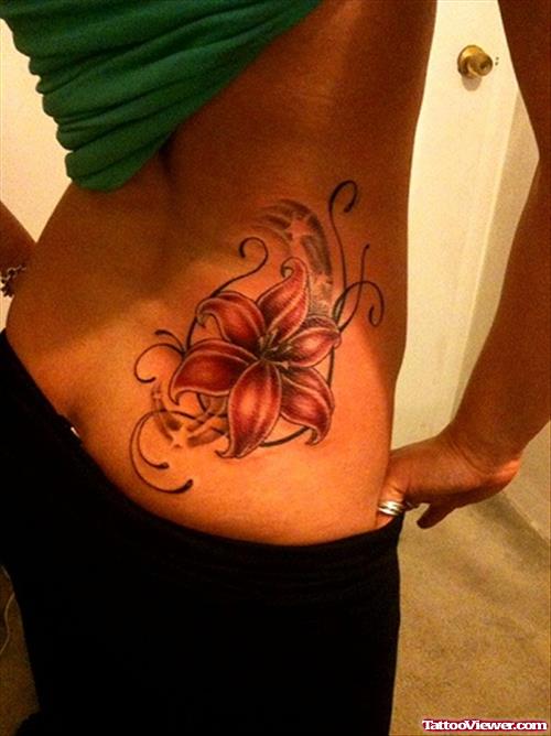 Hawaiian Flower Tattoo On Right Lowerback