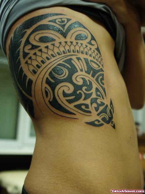 Black Ink Tribal Hawaiian Tattoo On Side Rib
