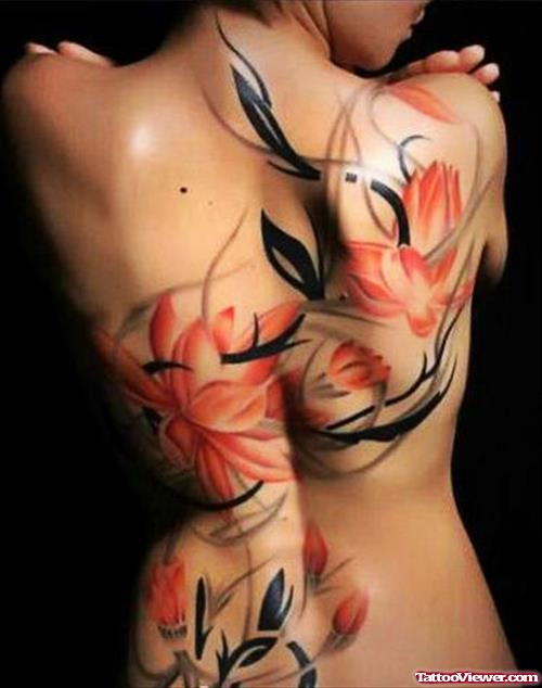Awesome Colored Flowers Hawaiian Tattoo On Girl Back