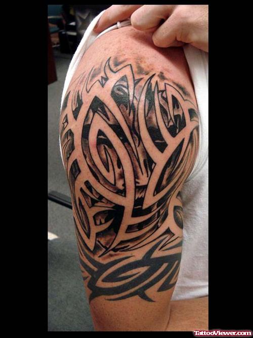 Grey Ink Tribal Hawaiian Tattoo On Man Right Half Sleeve