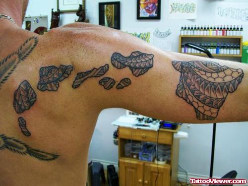 Grey Ink Hawaiian Tattoo On Half Sleeve