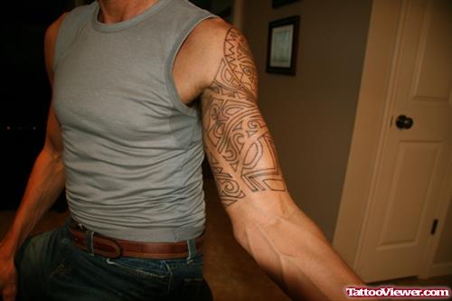 Nice Hawaiian Tattoo On Man Left Half Sleeve