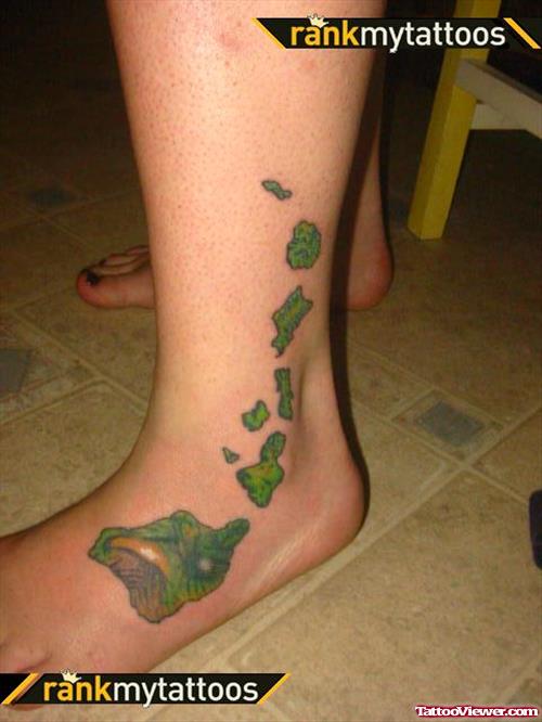 Green Ink Hawaiian Tattoo On Left Foot