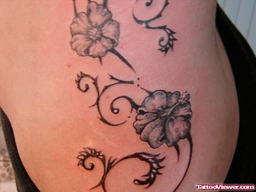 Grey Ink Hawaiian Tattoo On Side Rib