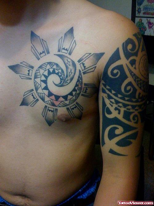 Tribal Hawaiian Tattoo On Man Chest And Half Sleeve
