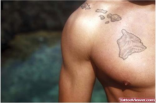 Grey Ink Hawaiian Tattoo On Man Chest