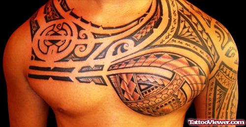 Amazing Tribal Hawaiian Tattoo On Man Chest and Half Sleeve