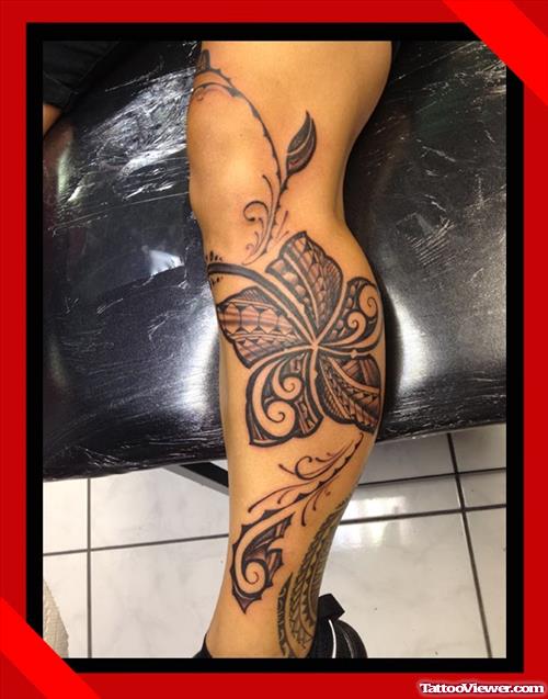 Grey Ink Hawaiian Flower Tattoo On Leg