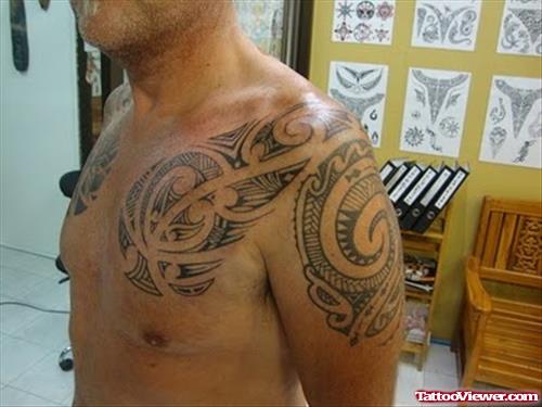 Amazing Tribal Hawaiian Tattoo On Man Chest And Left Shoulder