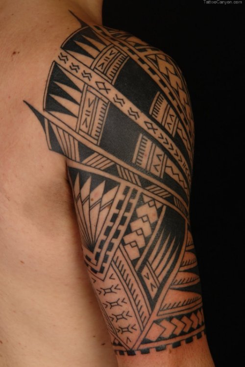Grey Ink Hawaiian Tattoo On Man Right Half Sleeve