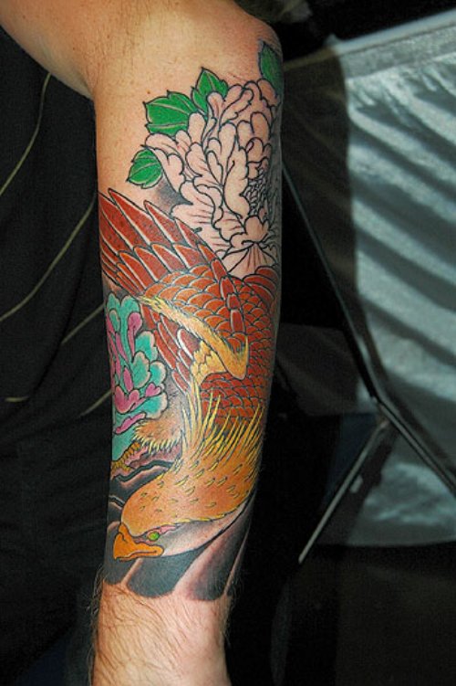 Japanese Colored Flowers And Hawk Tattoo On Left Arm