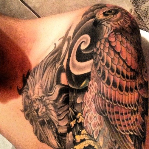 Lion Head And Hawk Tattoo On Left Shoulder