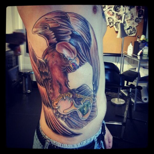 Rib Side Hawk Colored Ink Tattoo