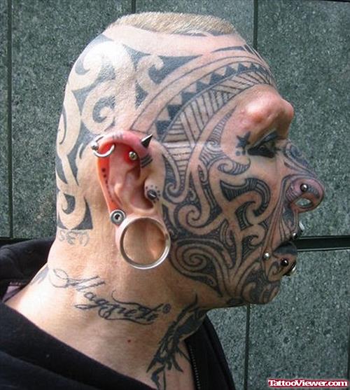 Polynesian Tribal Face And Head Tattoo