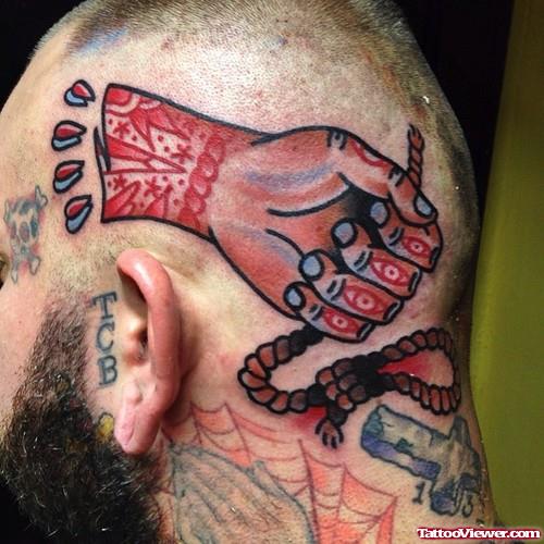 Cut Arm Head Tattoo