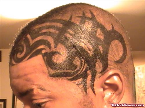 Black Ink Tribal Head Tattoo