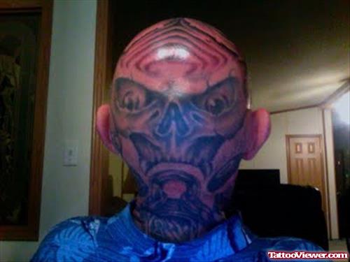 Bald Head Tattoo On Back Head