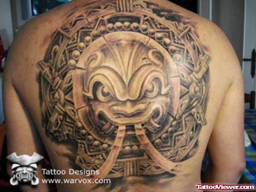 Grey Ink Aztec Head Tattoo On Back
