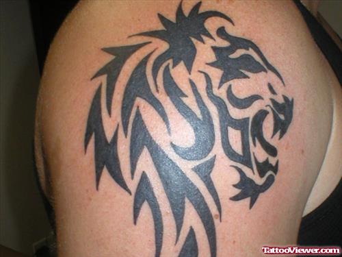 Black Ink Tribal Lion Head Tattoo On Shoulder