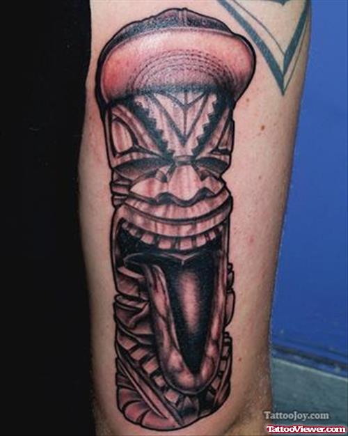 Grey Ink Tiki Head Tattoo