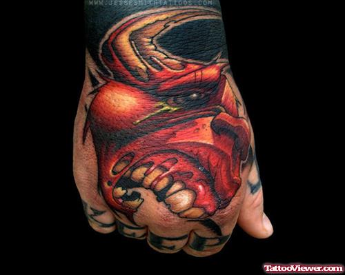 Red Ink Zombie Head Tattoo On Right Hand