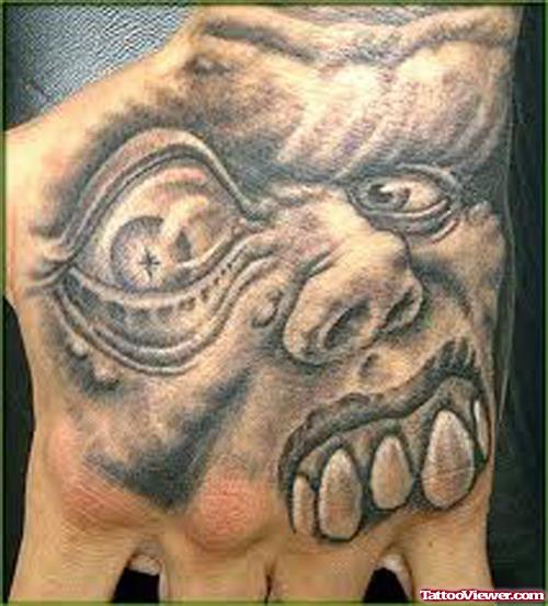 Grey Ink Skull Head Tattoo On Hand