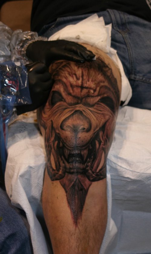 Grey Ink Head Tattoo On Leg