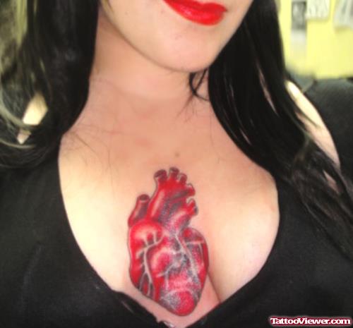 Girl With Heart Tattoo On Chest