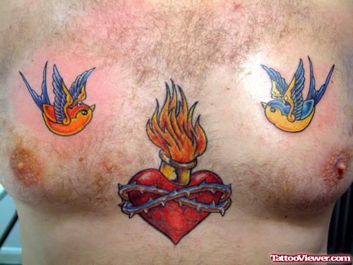 Colored Flying Birds and Sacred Heart Tattoo On Chest