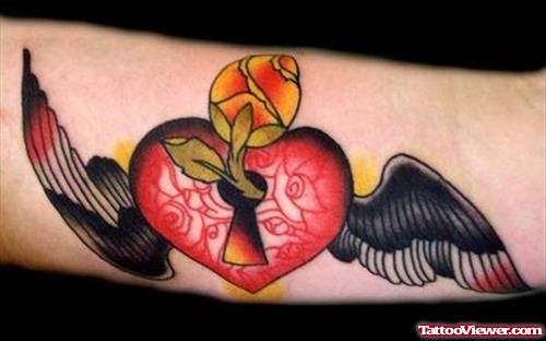 Winged Lock Heart Tattoo On Lowerback